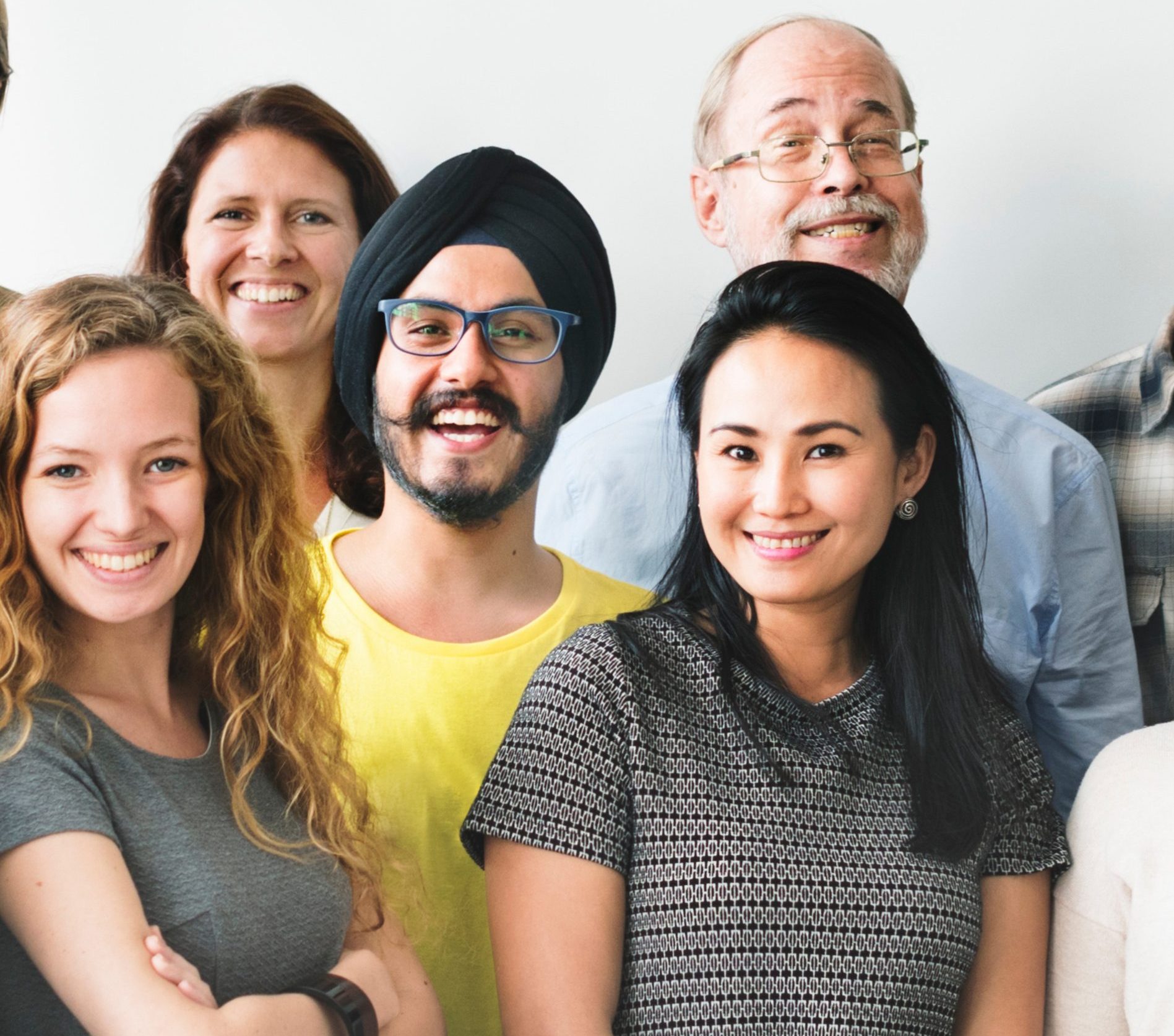 A team of diverse people doing a group photo